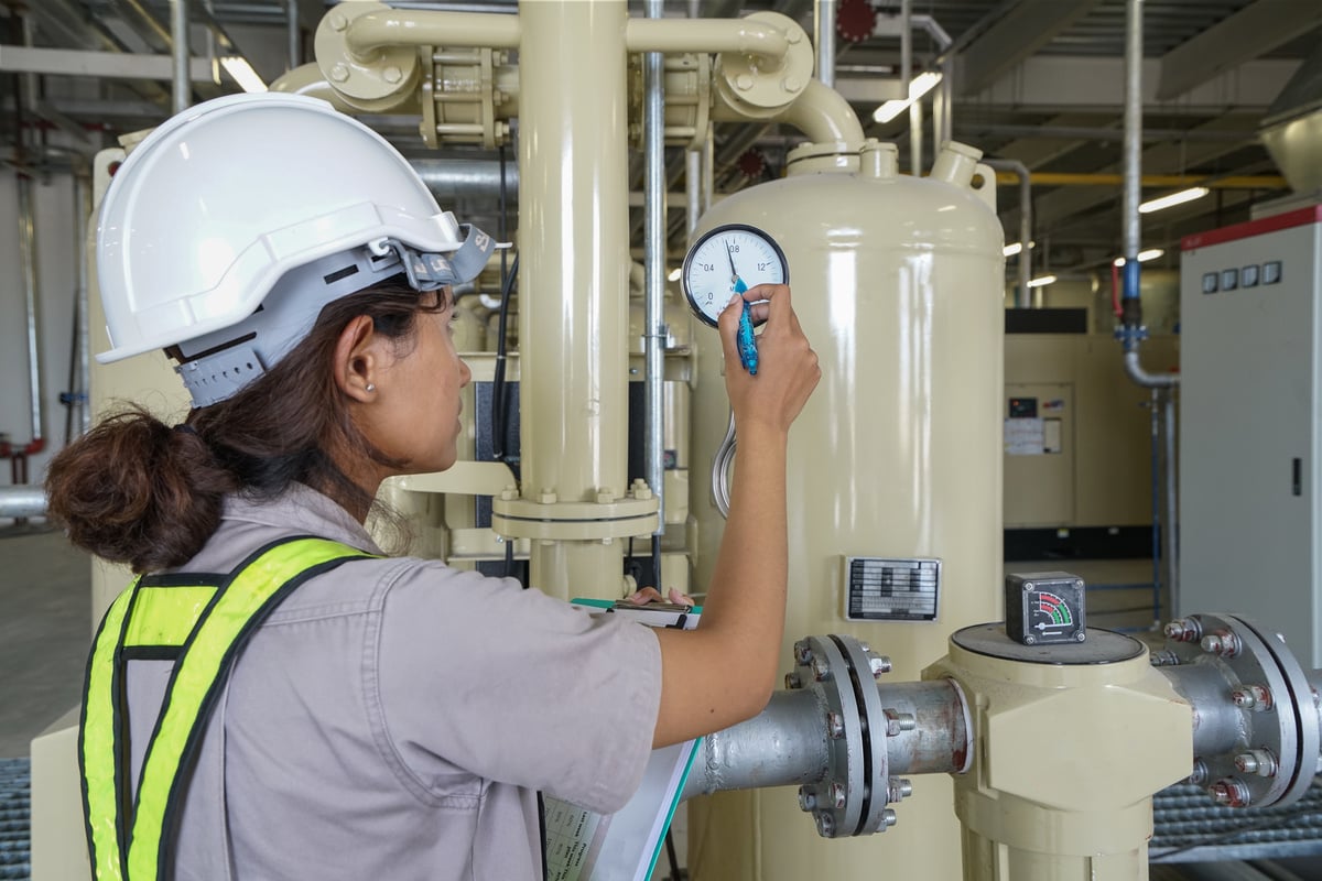 woman testing an air compressor